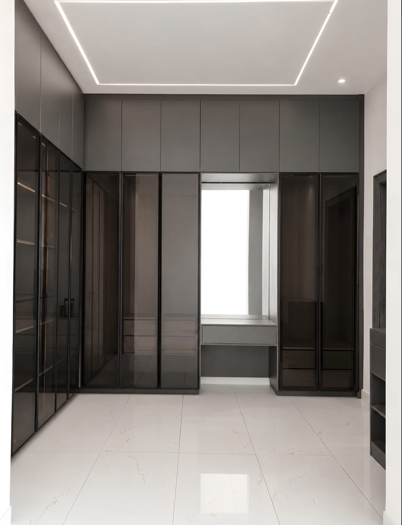 Walk in wardrobe in a modern Abuja terrace home