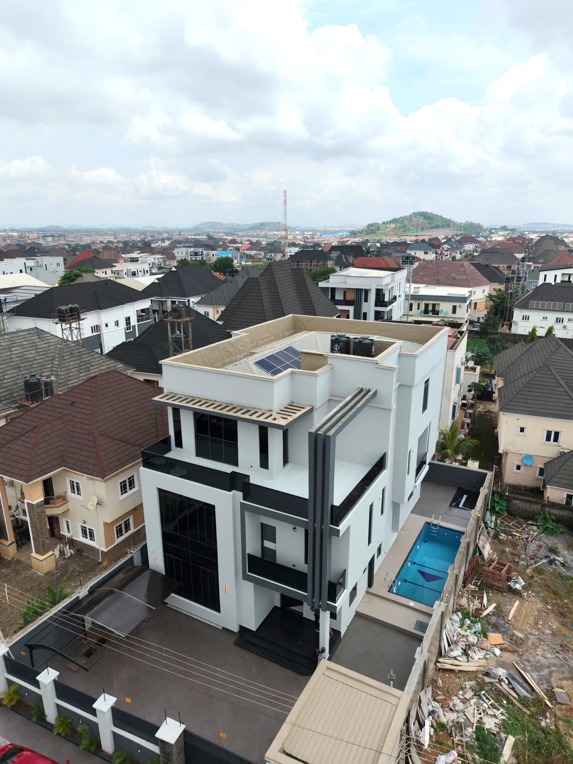 Aerial view of a modern Abuja house with swimming pool