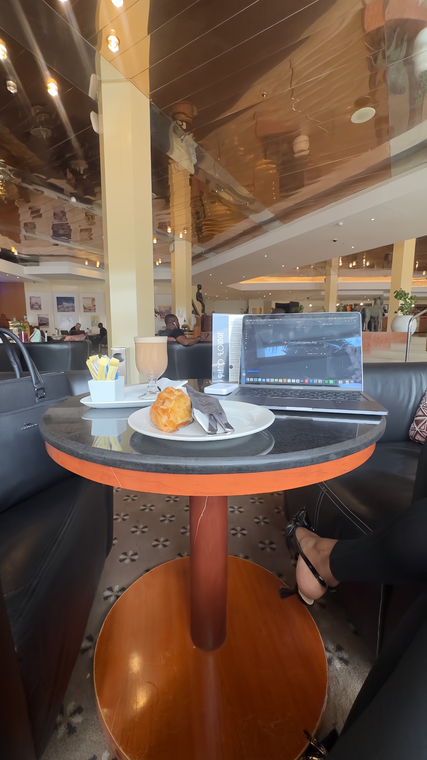 Joy O. Amadasun working from a professional setting in Abuja