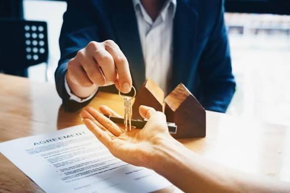 Property handover and agreement documents representing a real estate purchase
