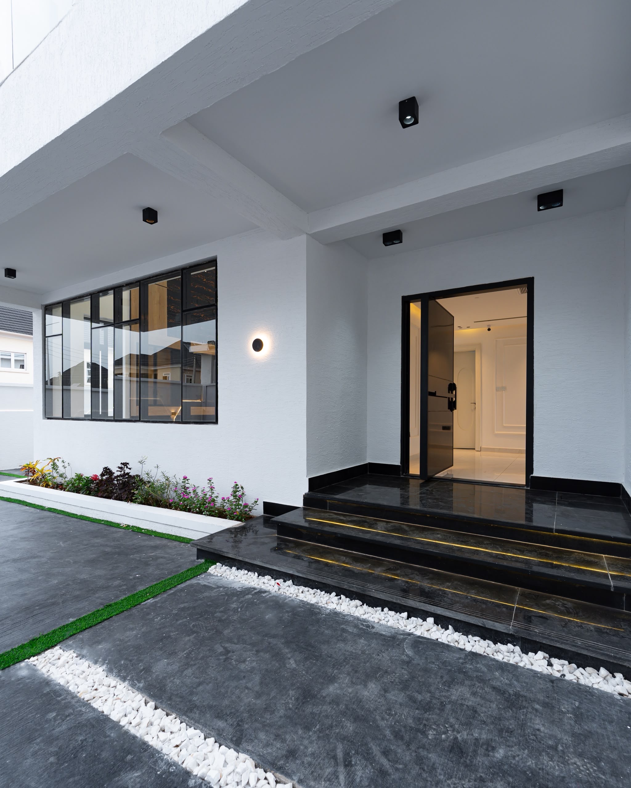 Modern property entrance and landscaped exterior